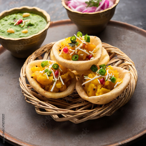 aloo tokri chaat or cheese potato basket stuffed chat or katori chat photo