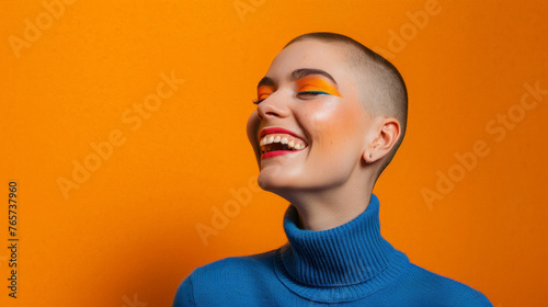 Vivid Expression: Joyful Woman with Glitter Makeup Laughing on Orange Background