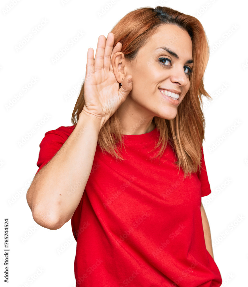 Hispanic young woman wearing casual red t shirt smiling with hand over ear listening an hearing to rumor or gossip. deafness concept. Hispanic young woman wearing casual red t shirt smiling with hand over ear listening an hearing to rumor or gossip. deafness concept.