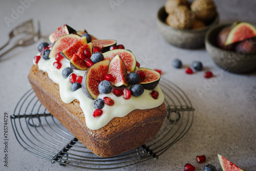 walnut cake decorated with figs and berries