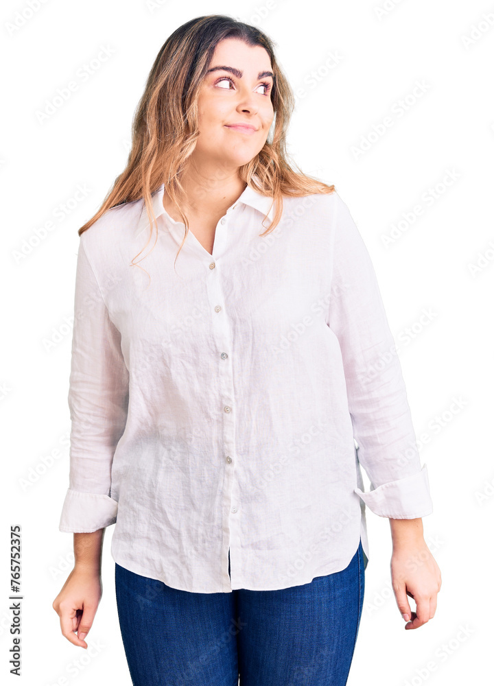 Young caucasian woman wearing casual clothes smiling looking to the side and staring away thinking. Young caucasian woman wearing casual clothes smiling looking to the side and staring away thinking.
