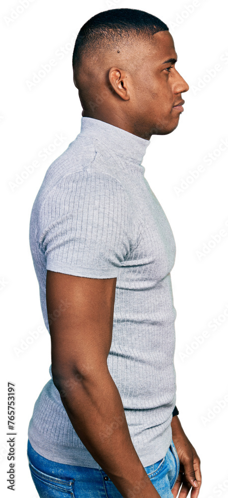 Young black man wearing casual t shirt looking to side, relax profile pose with natural face and confident smile.