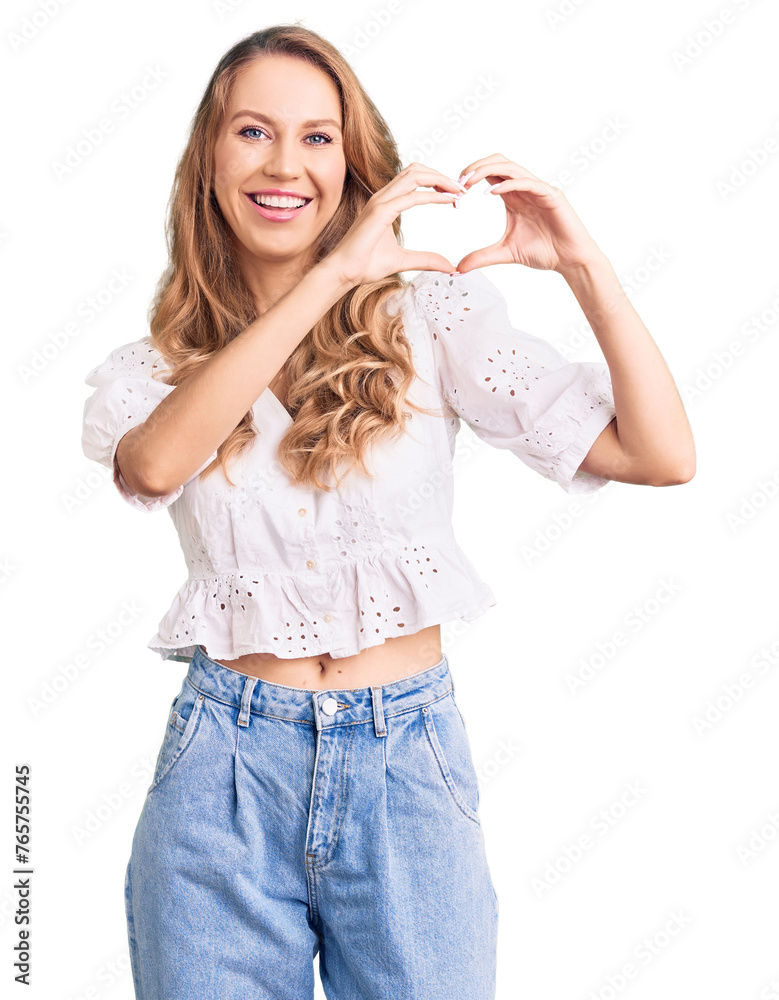 Young caucasian woman with blond hair wearing elegant summer tshirt smiling in love showing heart symbol and shape with hands. romantic concept. Young caucasian woman with blond hair wearing elegant summer tshirt smiling in love showing heart symbol and shape with hands. romantic concept.