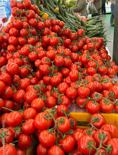 Fototapeta Naklejka Na Ścianę i Meble -  Abundance of vine ripe tomatoes at an outdoor market in Izmir, Turkey