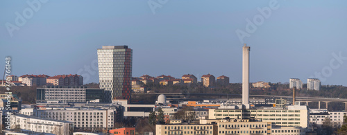 Apartment house and offices in the districts Årsta and Hammarby, a sunny winter day in Stockholm photo