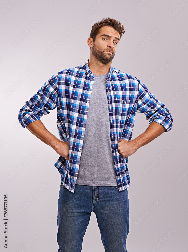 Portrait, doubt and man in studio for fashion with jeans or shirt isolated on gray background. Serious person, attitude or unsure in casual clothes for judgement or uncertain on backdrop in Australia Portrait, doubt and man in studio for fashion with jeans or shirt isolated on gray background. Serious person, attitude or unsure in casual clothes for judgement or uncertain on backdrop in Australia