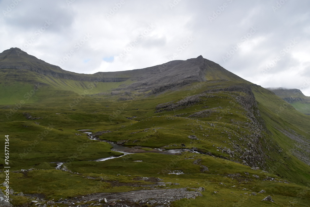 The dramatic coastline and green mountains of the Faroe Islands