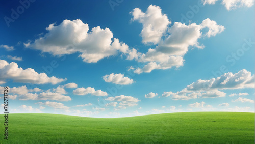 green field and blue sky with clouds