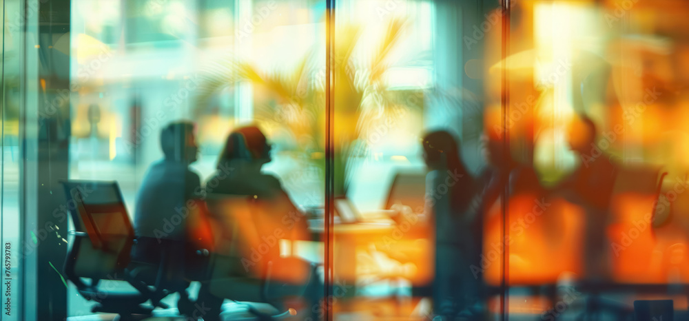 abstract view of business people in a meeting through glass with reflections