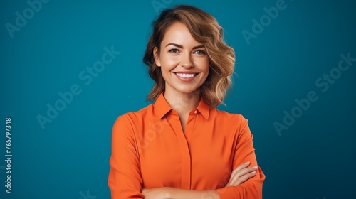 Photo of an attractive charming lady with a cute bobbed hairdo, arms crossed in a self-confident pose, embodying a friendly and approachable worker with a genuine smile and good mood 