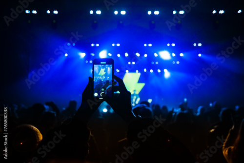 Hands with phones on concert, atmosphere on concert