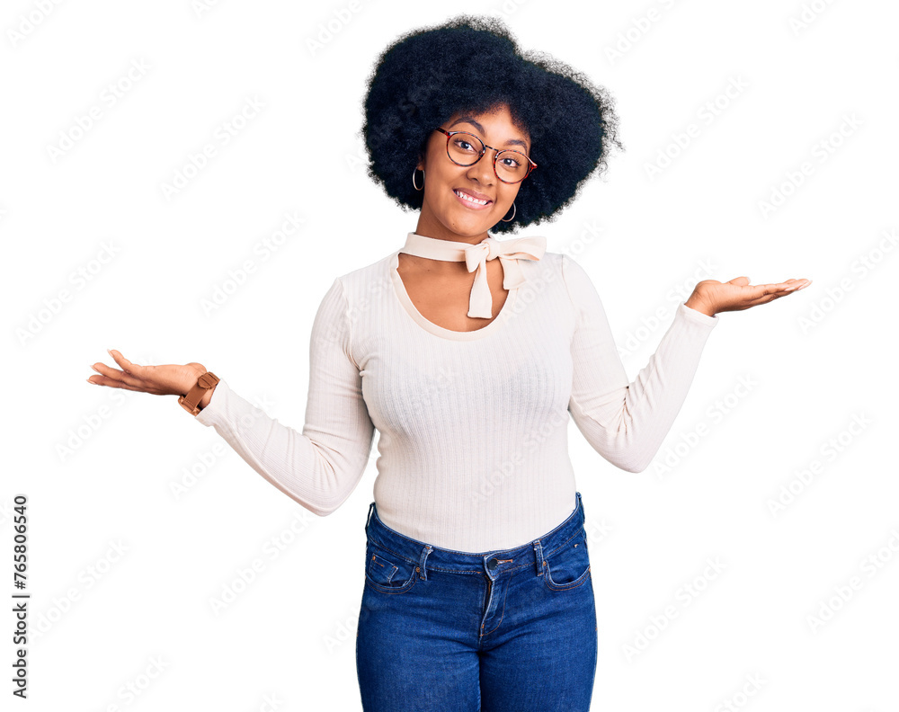Young african american girl wearing casual clothes and glasses smiling showing both hands open palms, presenting and advertising comparison and balance Young african american girl wearing casual clothes and glasses smiling showing both hands open palms, presenting and advertising comparison and balance