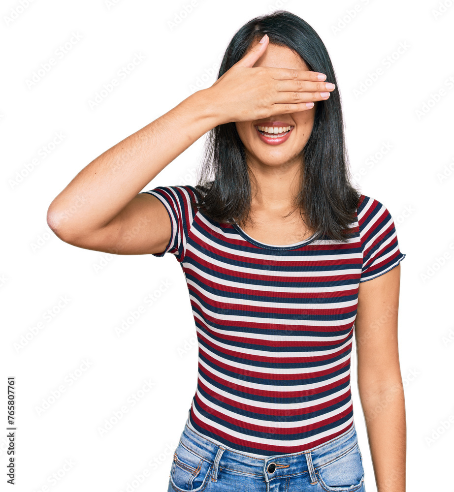 Beautiful asian young woman wearing casual clothes and glasses smiling and laughing with hand on face covering eyes for surprise. blind concept. Beautiful asian young woman wearing casual clothes and glasses smiling and laughing with hand on face covering eyes for surprise. blind concept.
