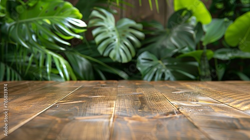 Wooden table with palm leaves background. summer and vacation concept. product display montage.