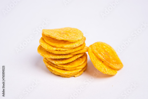 Green banana chips on white background 3