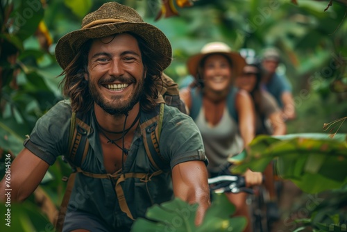 Happy man biking in a tropical jungle