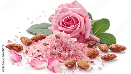 moisturizing salt scrub with pink flecks and roses and almonds on white background