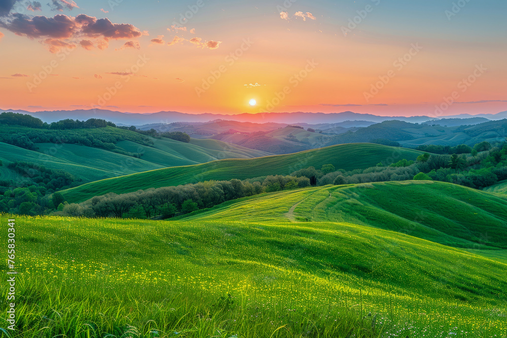 Captivating view of lush green hills bathed in sunset light, with a scenic sunburst and clear