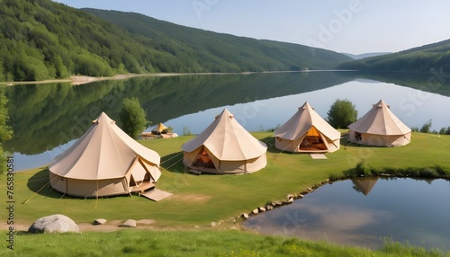 Glamping, few tents, lake on the foreground