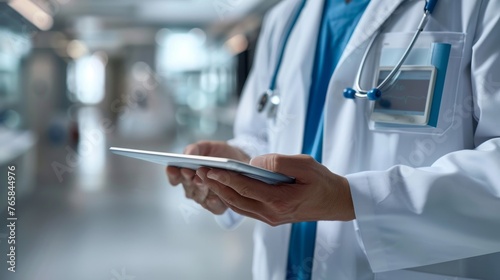 Healthcare Professional with Tablet in Hospital Corridor Close-up of a medical professional's hands using a digital tablet, reflecting modern healthcare and patient management.