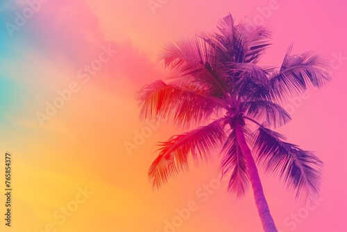 A palm tree stands tall against a vibrant  multicolored sky in the background