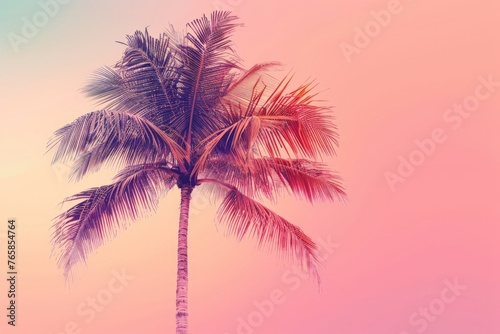 A tall palm tree with vibrant green leaves stands against a background of pink and blue sky, creating a striking contrast in colors