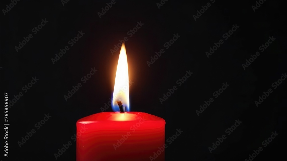 One red candle burns on a dark background. Memory, memorial, romance, prayer, religion. Copyspace, free space, place for text. One red candle burns on a dark background. Memory, memorial, romance, prayer, religion. Copyspace, free space, place for text.