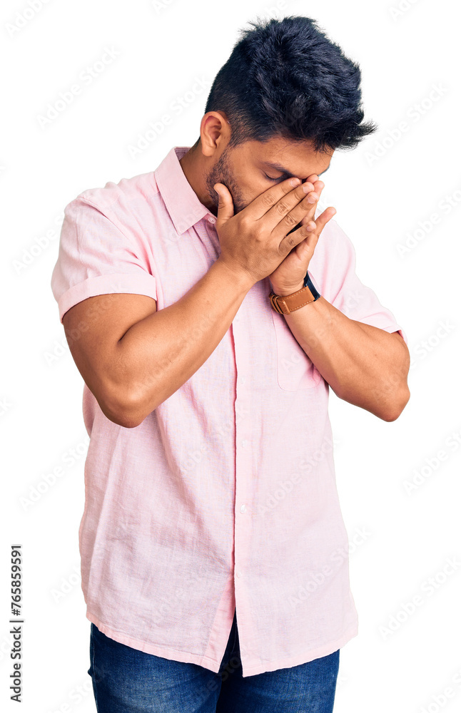 Handsome latin american young man wearing casual summer shirt with sad expression covering face with hands while crying. depression concept. Handsome latin american young man wearing casual summer shirt with sad expression covering face with hands while crying. depression concept.