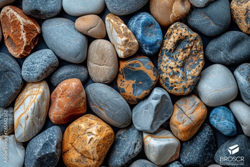 Colorful river stones with intricate patterns, showcasing geological diversity. photo