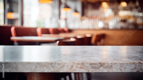 Empty marble table  blurred restaurant background with copy space