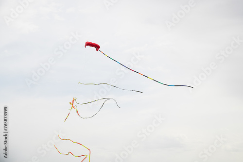 Flying kite on the background of the sky.
