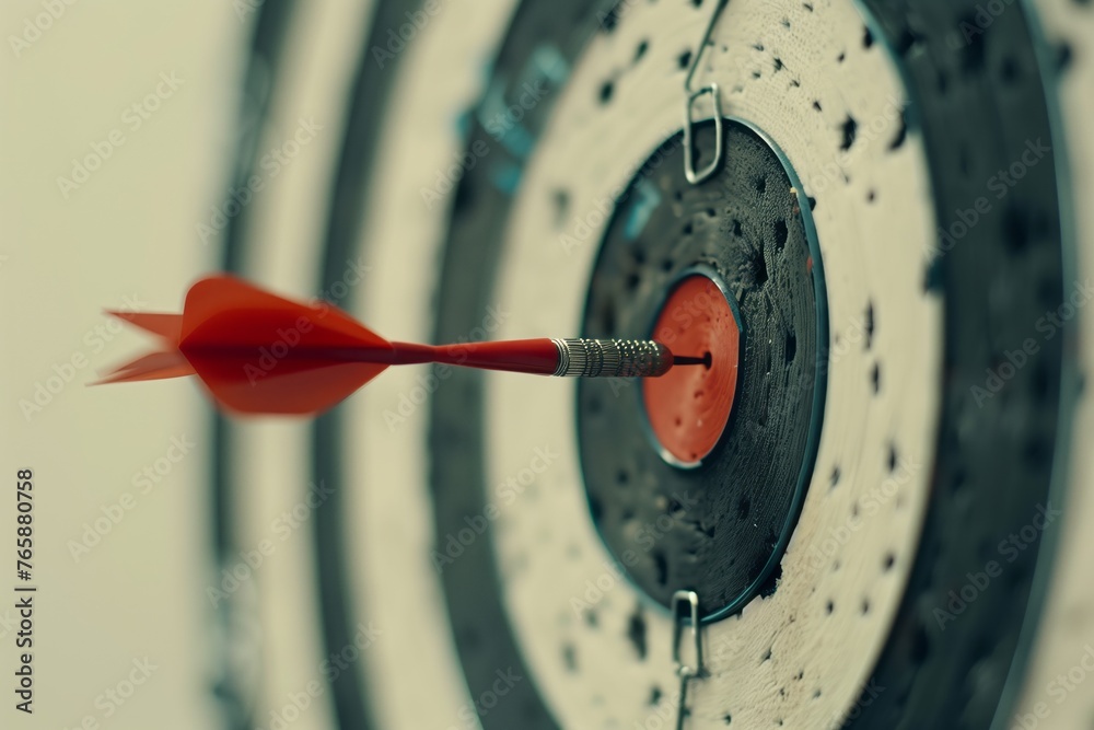 Darts hitting the bullseye on a dartboard, concept of success and goal-setting. Achievement of objectives and the fulfillment of aspirations. Darts hitting the bullseye on a dartboard, concept of success and goal-setting. Achievement of objectives and the fulfillment of aspirations.