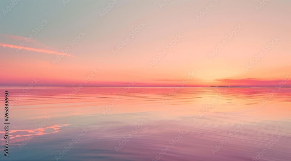 The sun is setting over the water, casting a pink hue across the sky, creating a serene scene