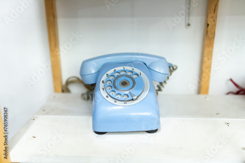 Old telephone on white background. Shallow depth of field.