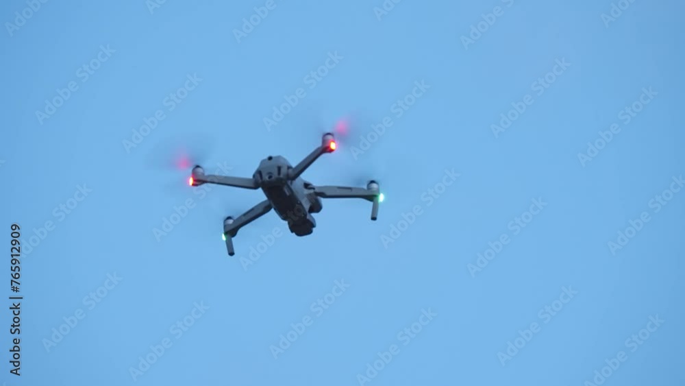 Military drone in flight observing positions at twilight sky, slow motion Military drone in flight observing positions at twilight sky, slow motion