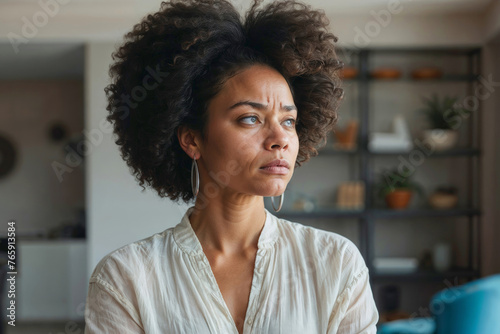 Afro woman very sad at home. Concept of loneliness and pain loss of love. Woman depression or domestic violence. People, grief and domestic violence concept