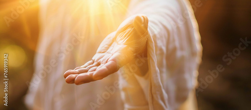 Jesus reaching out his hand against dark background Resurrected Jesus Christ reaching out hand and praying