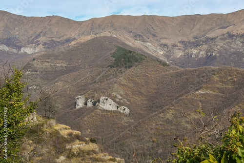 Elevated view of the Argentina Valley in the Ligurian hinterland, with the Corte Cliff (Falesia della Corte in Italian), a rock wall used for climbing, in winter, Triora, Imperia, Liguria, Italy photo