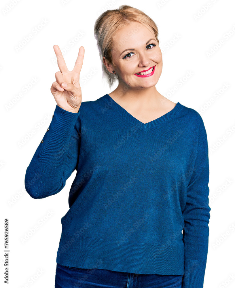 Φωτογραφία Young blonde woman wearing casual clothes showing and pointing up with fingers number two while smiling confident and happy