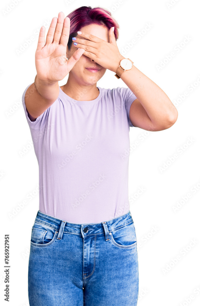 Young beautiful woman with pink hair wearing casual clothes covering eyes with hands and doing stop gesture with sad and fear expression. embarrassed and negative concept. Young beautiful woman with pink hair wearing casual clothes covering eyes with hands and doing stop gesture with sad and fear expression. embarrassed and negative concept.