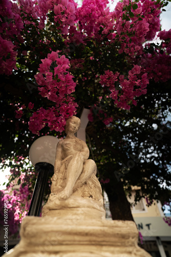 Obraz na płótnie A typical sculpture next to street light against tree as a decorative monument in an entrace w salonie