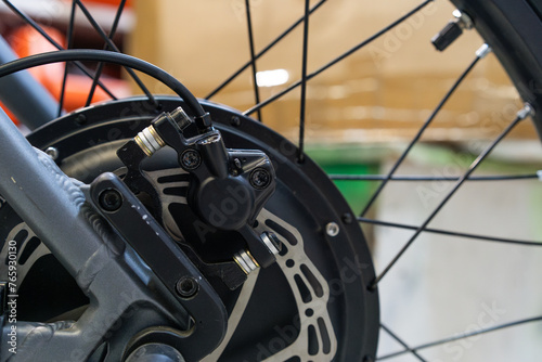 Electric bike rear hydraulic disc brake caliper close up