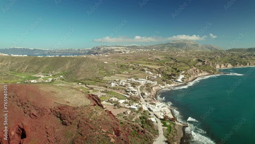 Rising drone Santorini Aerial view with red sand and adreatic sea and the mountains Rising drone Santorini Aerial view with red sand and adreatic sea and the mountains