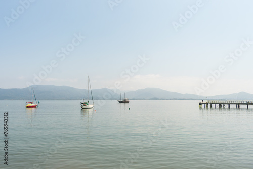 Sao Francisco de Sul, Brazil - August 22th 2023: Yachts and boats in Babitonga bay near the historic center of Sao Francisco do Sul, oldest city of Santa Catarina photo