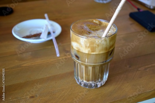 Delicious cold freddo cappuccino coffee at a greek cafe in summer