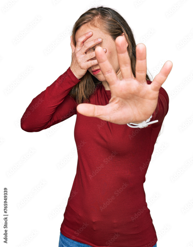 Young blonde woman wearing casual clothes covering eyes with hands and doing stop gesture with sad and fear expression. embarrassed and negative concept. Young blonde woman wearing casual clothes covering eyes with hands and doing stop gesture with sad and fear expression. embarrassed and negative concept.