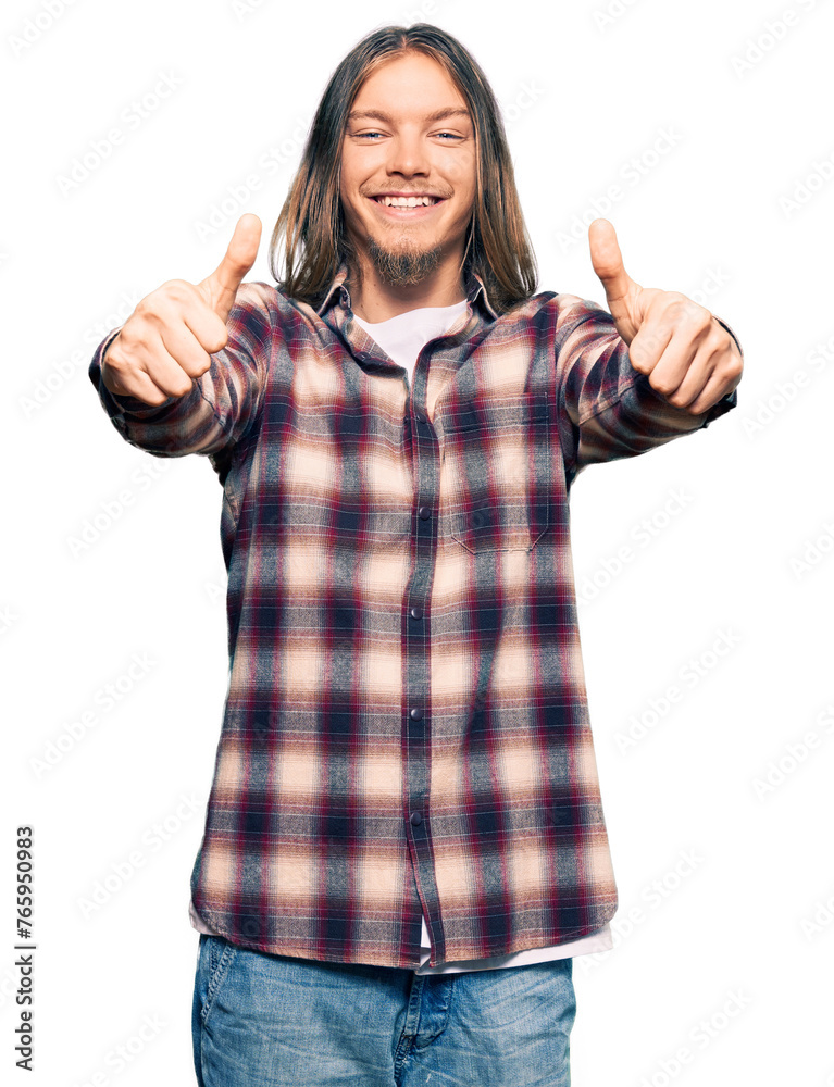 Handsome caucasian man with long hair wearing hipster shirt approving doing positive gesture with hand, thumbs up smiling and happy for success. winner gesture. Handsome caucasian man with long hair wearing hipster shirt approving doing positive gesture with hand, thumbs up smiling and happy for success. winner gesture.