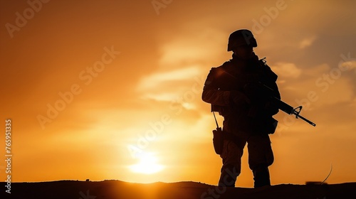 Silhouette of a soldier in sunset, concept of protection, US soldier, terror attack, mercenary.