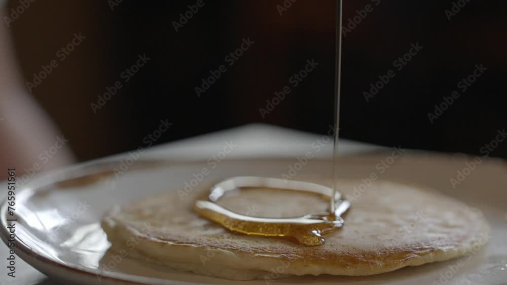 Pouring Maple Syrup on Pancakes Pouring Maple Syrup on Pancakes