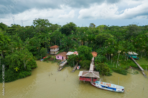 Cuadro en lienzo Aerial View of a Small Community Houses in Tropical Rainforest by the River Near